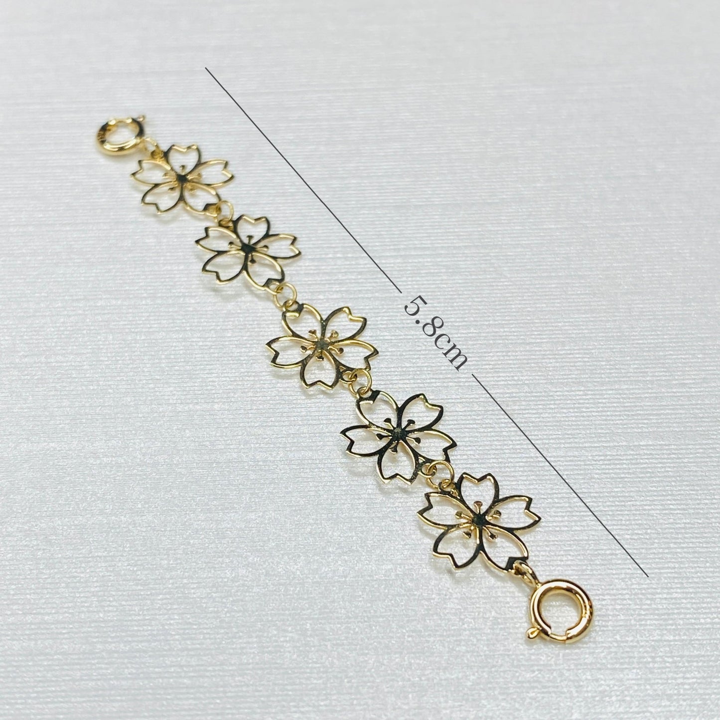 K18YG 引き輪 ヒキワ ひきわ 花 桜 梅 チェーンパーツ ネックレスパーツ YG 18K チャーム 両開口 コマ 花モチーフ 1.8cm / 3.8cm / 5.8cm 延伸 延ばす - Jewelry Hills Tokyo